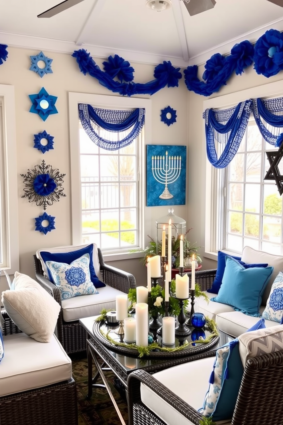 A festive sunroom adorned with Hanukkah-themed wall art. The walls feature vibrant blue and silver decorations, including a large menorah painting and star of David accents. Cozy seating arrangements are complemented by plush cushions in shades of blue and white. A beautifully arranged table displays a collection of candles and festive decor, creating a warm and inviting atmosphere.