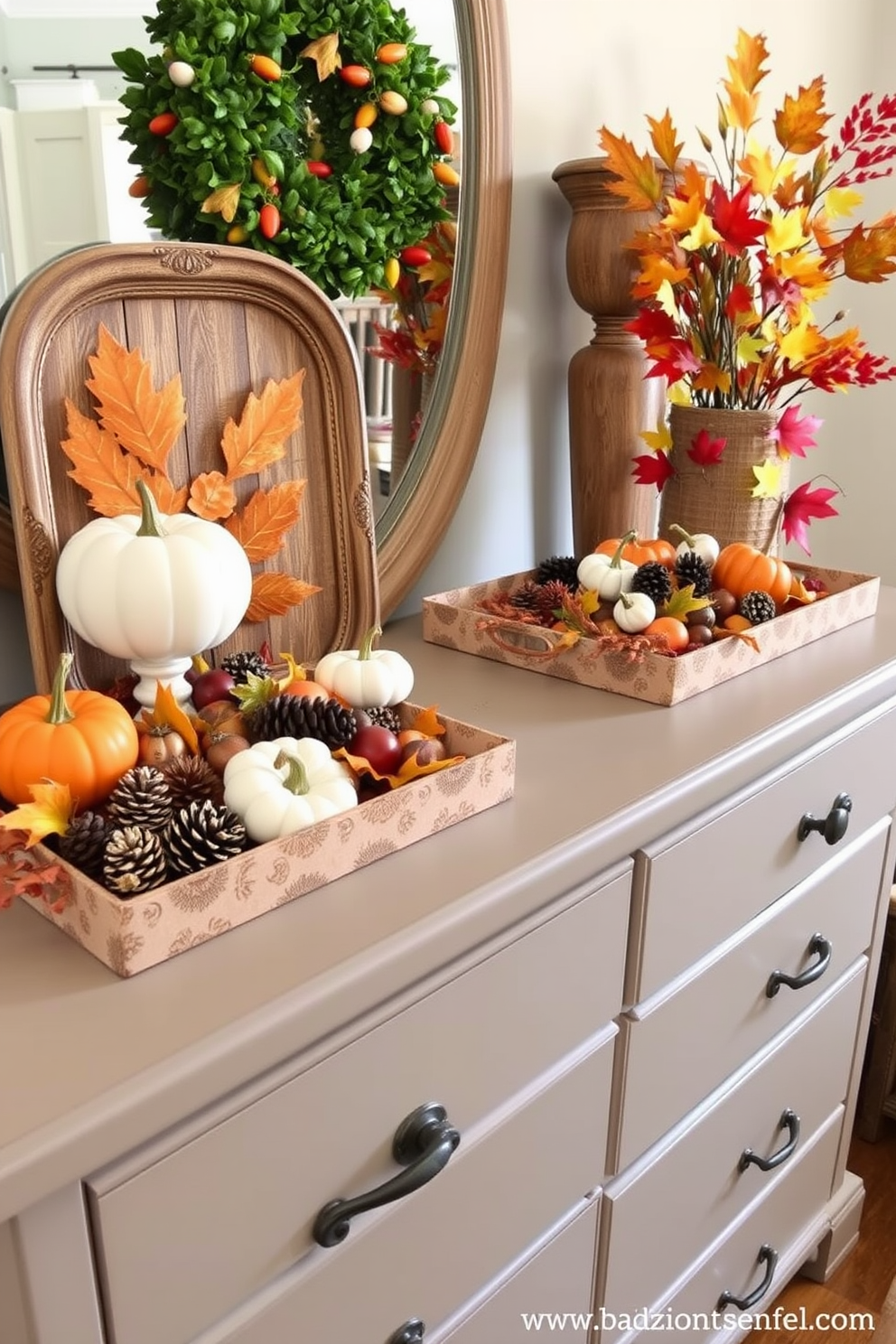 A beautifully styled dresser adorned with harvest-themed decorative trays. The trays feature an array of autumnal elements such as mini pumpkins, pinecones, and colorful leaves, creating a warm and inviting atmosphere for Thanksgiving.