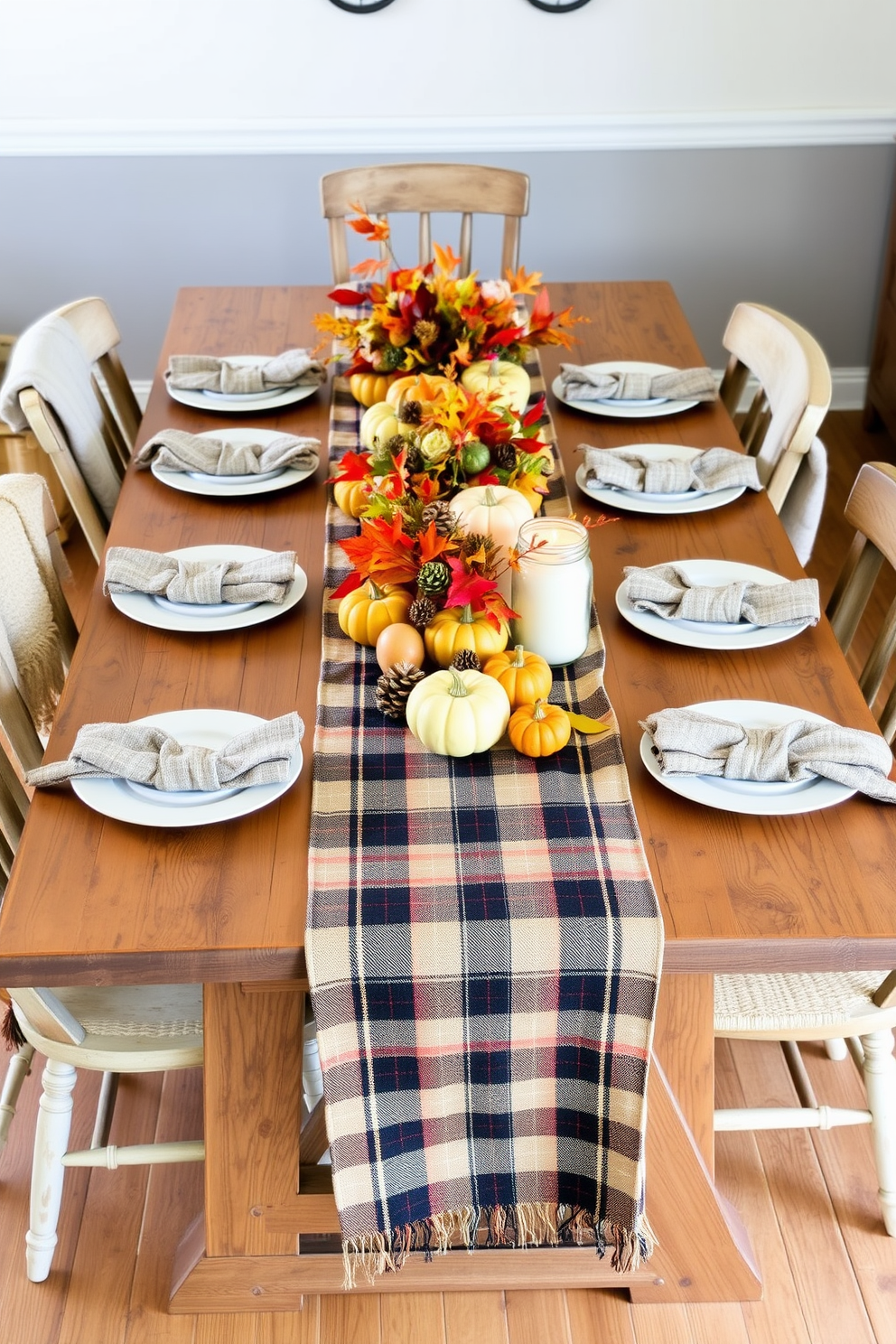 A rustic wooden table is beautifully set for Thanksgiving, adorned with a plaid table runner and white ceramic plates. Surrounding the table are mismatched wooden chairs, each with a cozy throw draped over the back, creating a warm and inviting atmosphere. Centerpiece arrangements feature seasonal elements like mini pumpkins, pinecones, and vibrant autumn leaves. Soft candlelight flickers from mason jars, adding a touch of warmth to the rustic decor and enhancing the festive spirit.