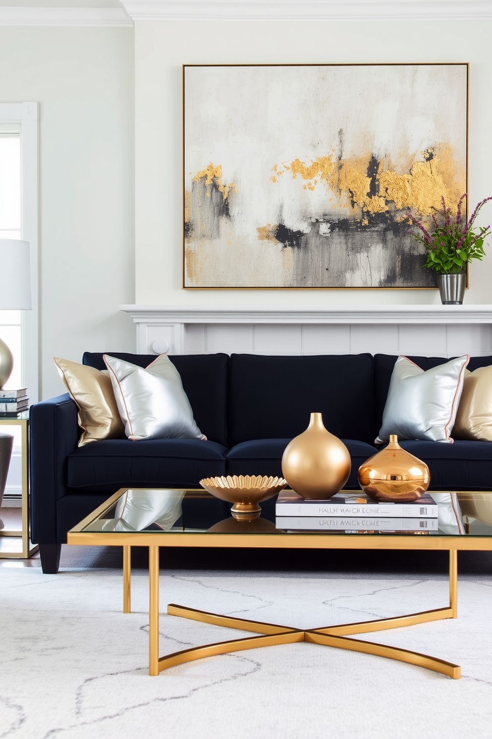 A contemporary living room adorned with mixed metallic accents. The coffee table features a sleek gold frame with a glass top, while the side tables are finished in brushed nickel. The sofa is upholstered in a rich navy fabric, complemented by metallic throw pillows in silver and bronze. A large abstract painting with hints of gold and copper hangs above the mantel, creating a striking focal point.