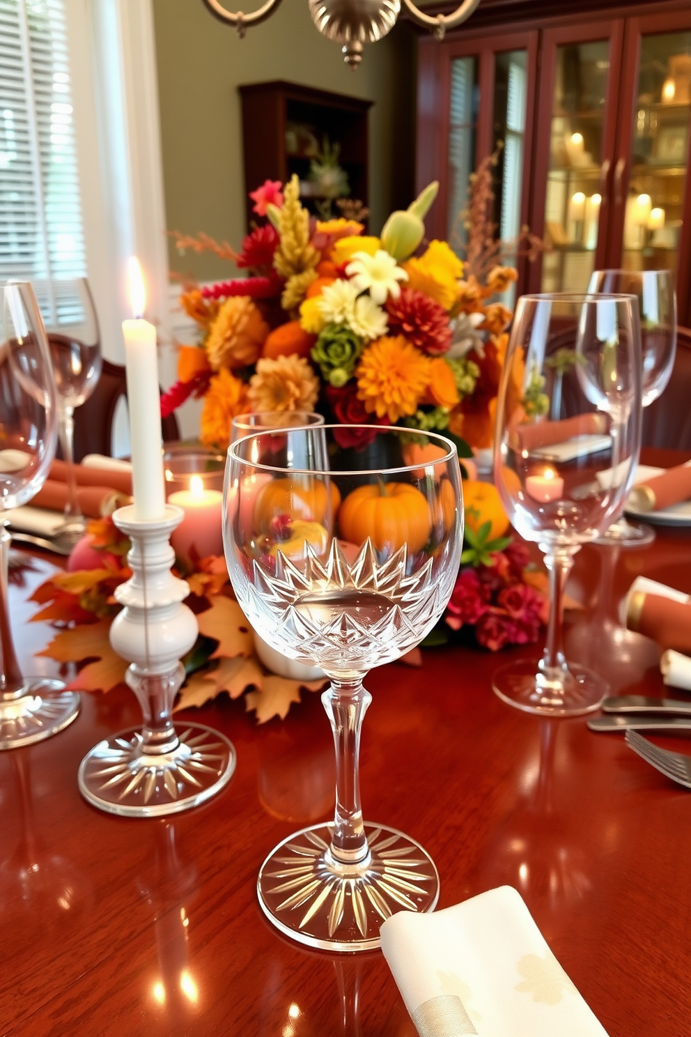 Elegant crystal glassware for drinks. The glassware is beautifully arranged on a polished wooden table, reflecting the soft glow of candlelight. Thanksgiving Dining Room Decorating Ideas. A warm autumn color palette fills the room, with a centerpiece of seasonal fruits and flowers adorning the table.