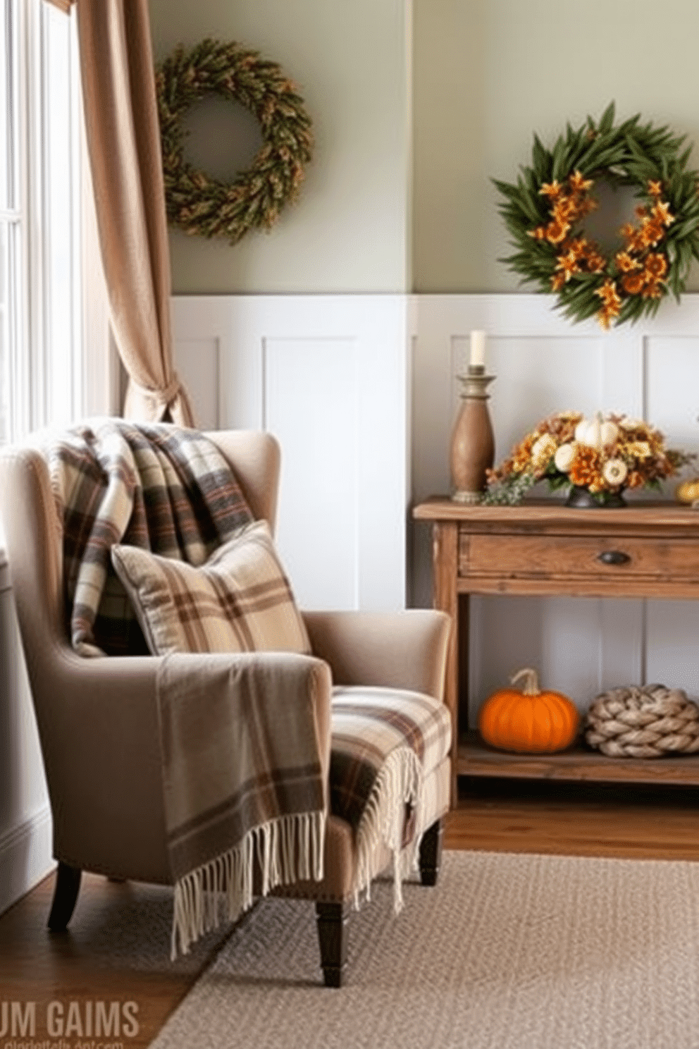 A cozy chair is adorned with a soft plaid blanket, adding warmth and texture to the space. The chair is positioned near a window, allowing natural light to highlight the colors of the blanket. The entryway is beautifully decorated for Thanksgiving, featuring a rustic wooden console table. On the table, a centerpiece of seasonal flowers and pumpkins creates a welcoming atmosphere.