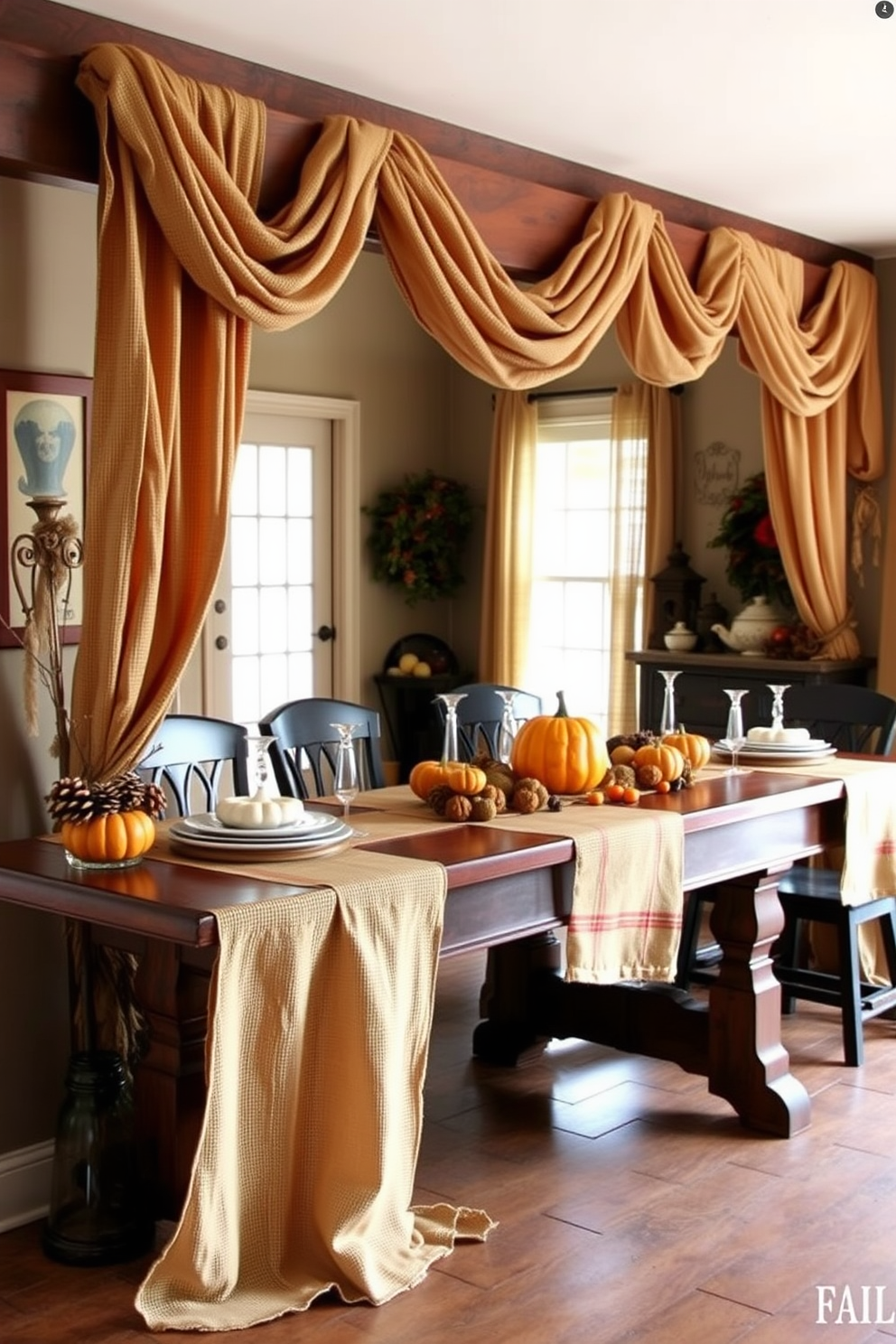 A cozy hallway adorned with burlap tablecloths drapes elegantly over a long wooden table. The rustic charm is enhanced by autumnal decorations, including pumpkins and pinecones, creating a warm and inviting atmosphere for Thanksgiving.