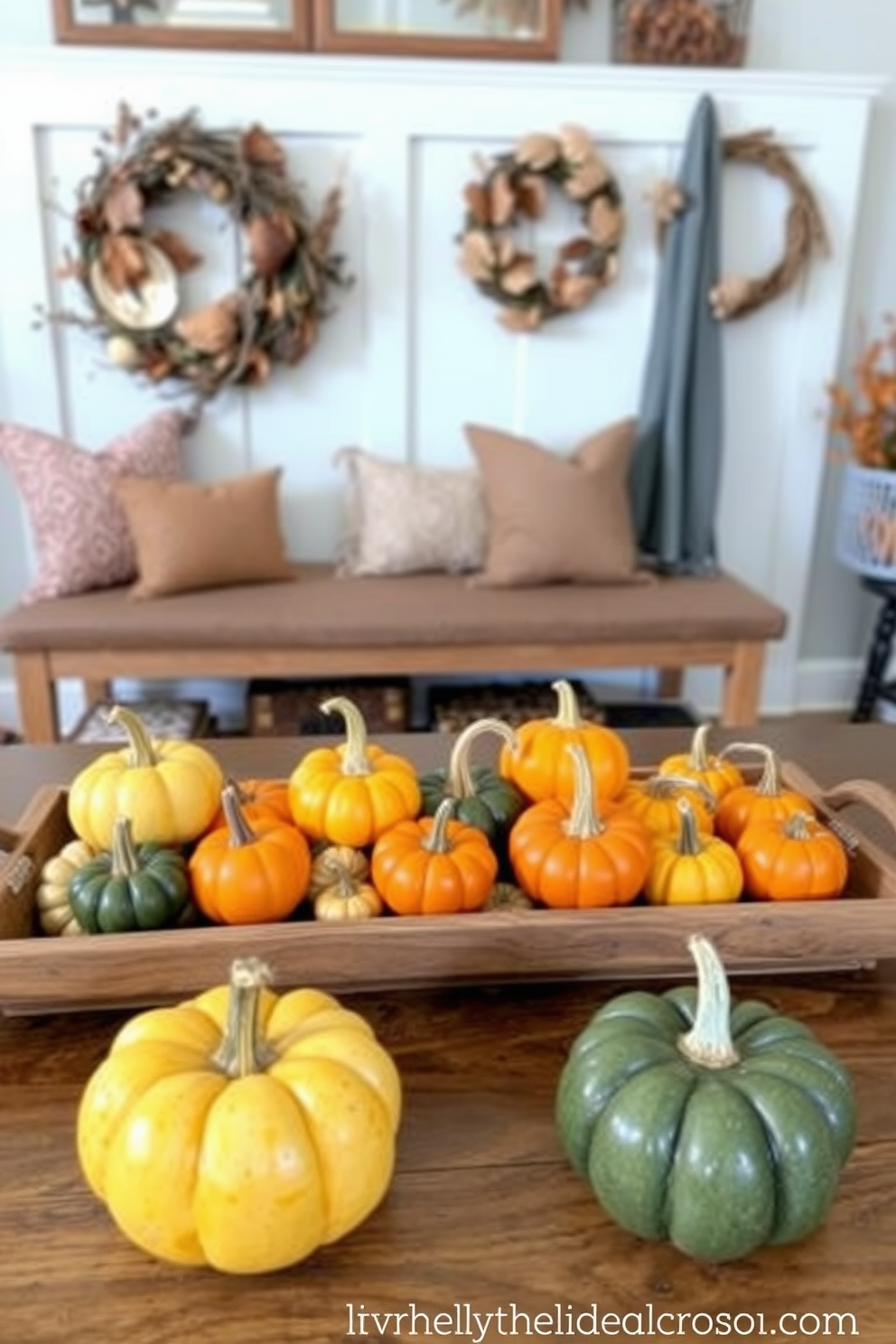 Small pumpkins as table centerpieces. Arrange an assortment of small pumpkins in varying sizes and colors on a rustic wooden tray. Thanksgiving mudroom decorating ideas. Incorporate warm, earthy tones with a cozy bench and seasonal decor like dried leaves and wreaths.