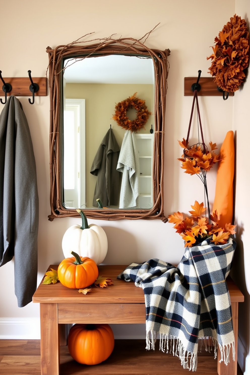 A rustic mirror framed with twigs is the focal point of the mudroom. Surrounding the mirror are hooks for coats and a bench made from reclaimed wood, creating a warm and inviting atmosphere. Thanksgiving decorations adorn the space with pumpkins and autumn leaves arranged on the bench. A cozy plaid blanket is draped over the side, adding a touch of seasonal charm.