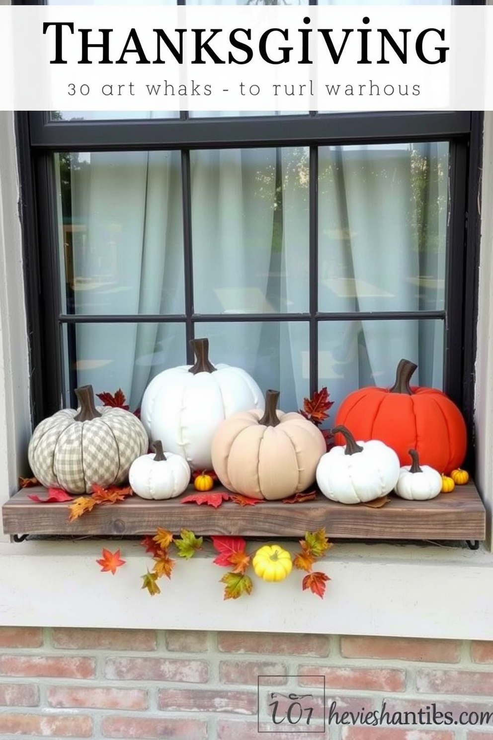 A charming window display for Thanksgiving featuring fabric pumpkins in various sizes. The pumpkins are arranged on a rustic wooden ledge, complemented by autumn leaves and small gourds to enhance the seasonal theme.