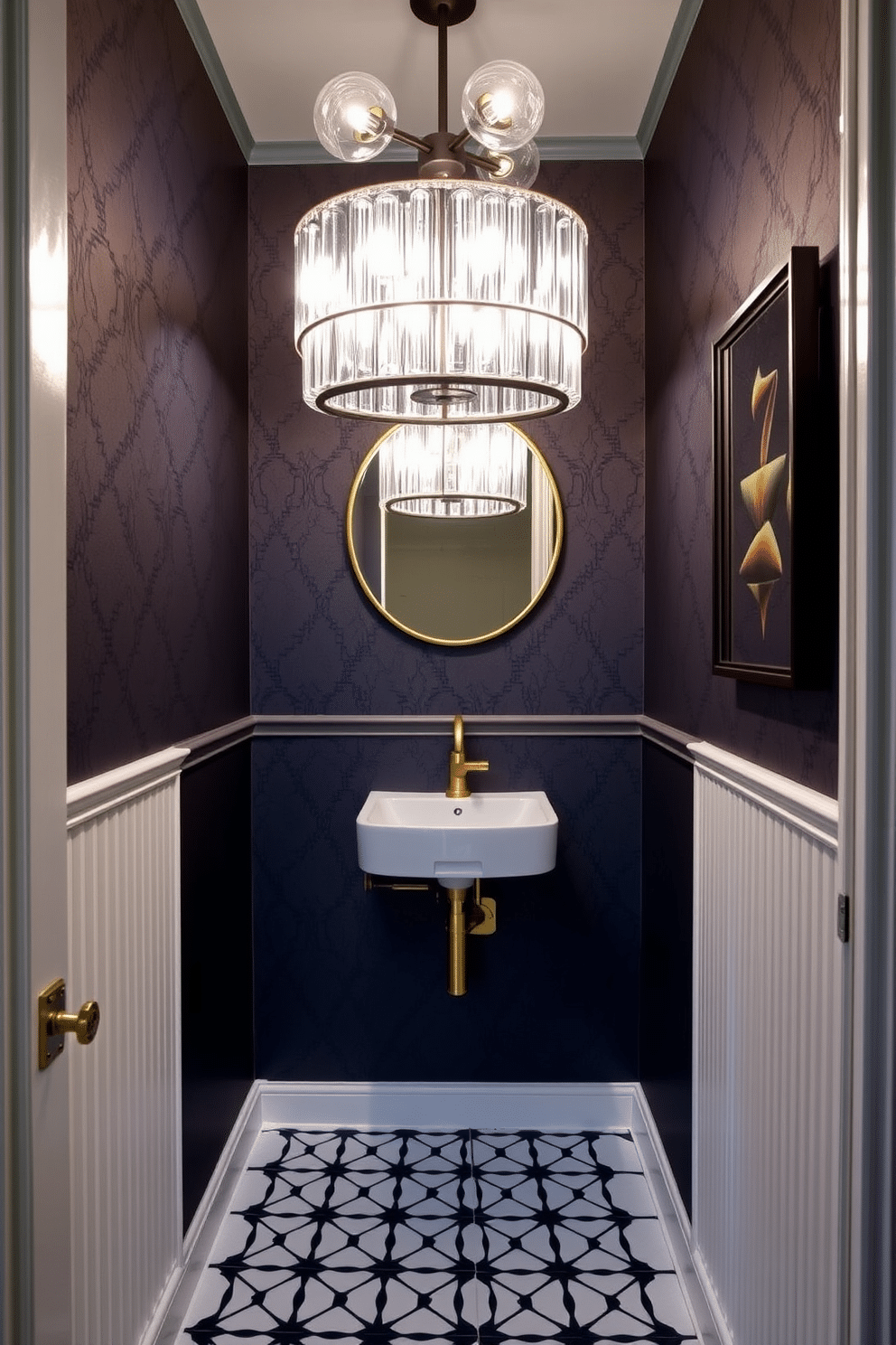 A tiny powder room featuring bold lighting fixtures as statement pieces. The walls are adorned with a deep navy blue wallpaper, creating a striking backdrop for an oversized, modern chandelier that draws the eye upward. A sleek, wall-mounted sink with a gold faucet complements the rich color scheme. The floor is covered in a geometric black and white tile, adding a touch of contemporary flair to the compact space.