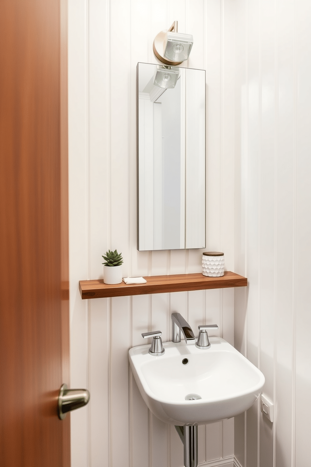 A tiny powder room features a sleek wall-mounted sink that maximizes floor space, paired with a floating shelf above for decorative items. The walls are adorned with vertical shiplap in a soft pastel color, creating an illusion of height and openness. Incorporating a tall, narrow mirror above the sink enhances the sense of space, while a compact, stylish light fixture adds warmth. A small potted plant on the shelf introduces a touch of greenery, bringing life to the cozy area.