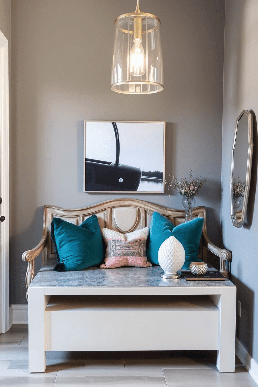 A vintage wooden bench is positioned against the wall, adorned with plush, colorful throw pillows that add a contemporary touch. Above the bench, a sleek, modern art piece contrasts beautifully with the rustic charm of the bench, creating an inviting focal point. The entryway features a stylish console table with a glossy finish, topped with a decorative mirror and a few carefully curated accessories. Soft, ambient lighting from a contemporary pendant fixture illuminates the space, enhancing the welcoming atmosphere.