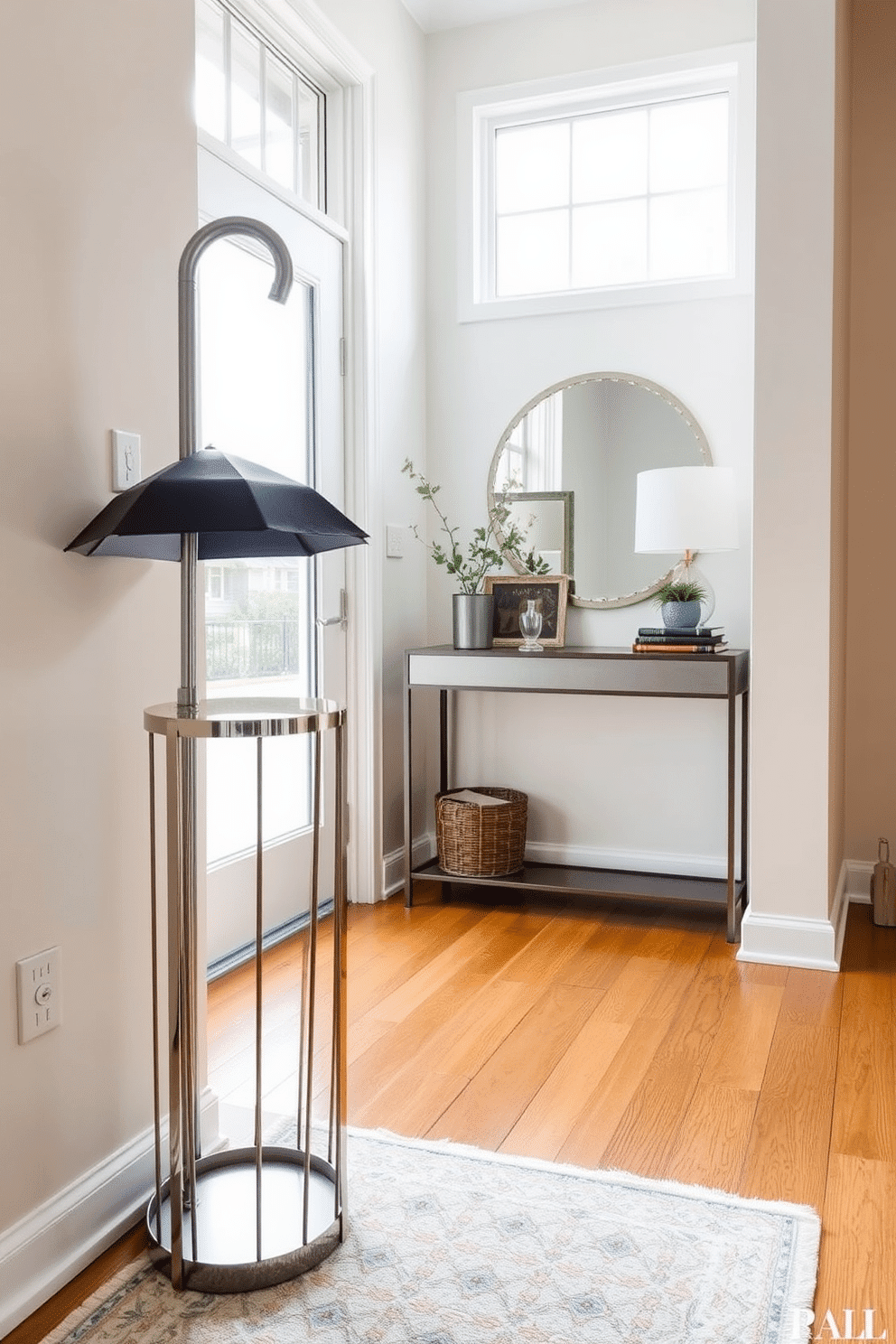 A chic umbrella stand designed for rainy days sits elegantly in the corner of the townhouse entryway. Crafted from polished metal with a sleek, modern silhouette, it complements the warm wooden flooring and soft, neutral wall colors. The entryway features a stylish console table adorned with a decorative mirror and a small potted plant. Natural light floods in through a large window, highlighting the inviting atmosphere with a cozy area rug beneath the table.