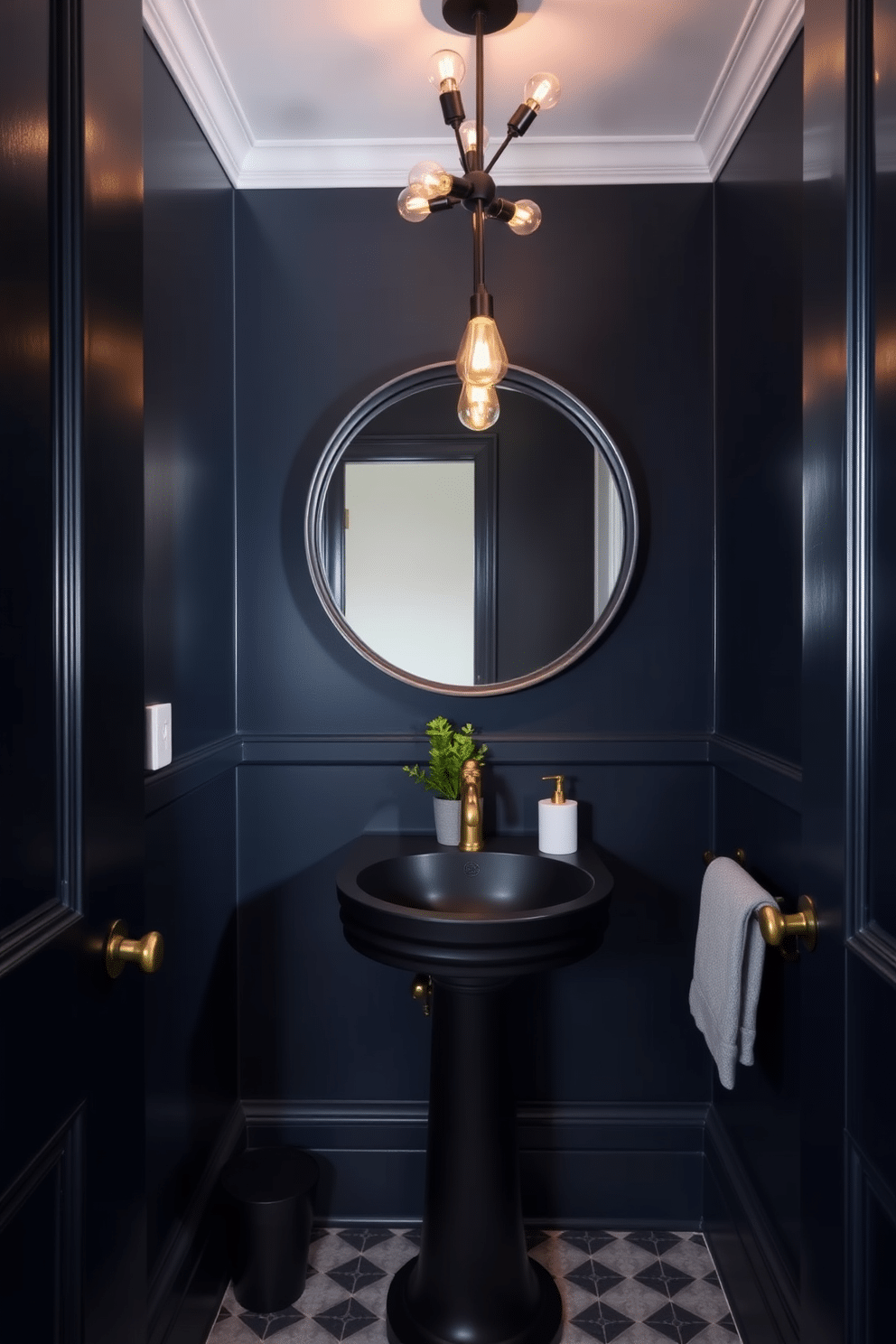 A trendy powder room with dark navy blue walls that create a moody and intimate atmosphere. The space features a sleek black pedestal sink with a gold faucet and a large round mirror framed in matte black. A stylish light fixture with exposed bulbs hangs from the ceiling, casting a warm glow over the room. To enhance the ambiance, a small potted plant sits on a floating shelf, adding a touch of greenery against the dark backdrop.