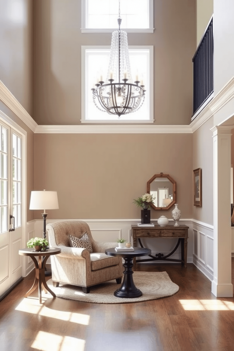 A cozy seating nook in the foyer features a plush, oversized armchair upholstered in a soft, textured fabric, paired with a round wooden side table. Natural light pours in through large windows, illuminating the space and highlighting a small collection of potted plants on the windowsill. The two-story foyer showcases a stunning chandelier that hangs gracefully from the vaulted ceiling, casting a warm glow over the area. Elegant wainscoting lines the walls, while a stylish console table adorned with decorative accessories adds a touch of sophistication to the entrance.