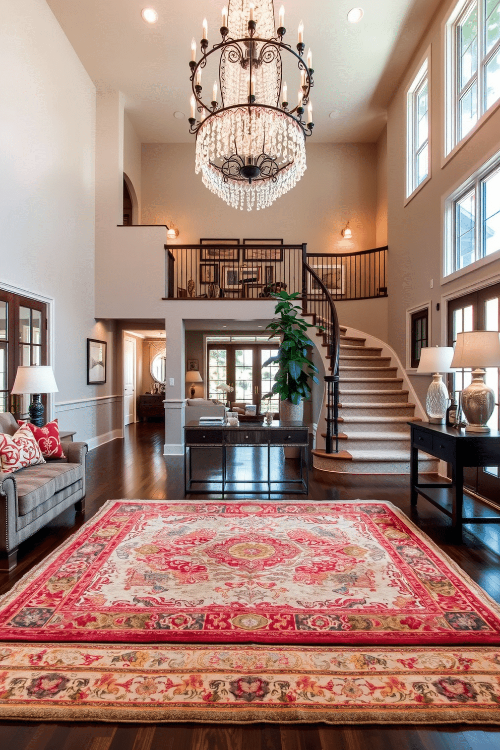 Layered rugs in a cozy living room setting, featuring a large, neutral-toned area rug as the base, topped with a smaller, vibrant patterned rug that adds depth and visual interest. The room is accented with plush seating, warm lighting, and decorative pillows that complement the colors of the rugs, creating an inviting atmosphere. A grand two-story foyer with an elegant staircase as the focal point, adorned with a wrought-iron railing and a stunning chandelier that cascades from the ceiling. The space features large windows that allow natural light to flood in, highlighting a console table with decorative accents and a large potted plant for a touch of greenery.