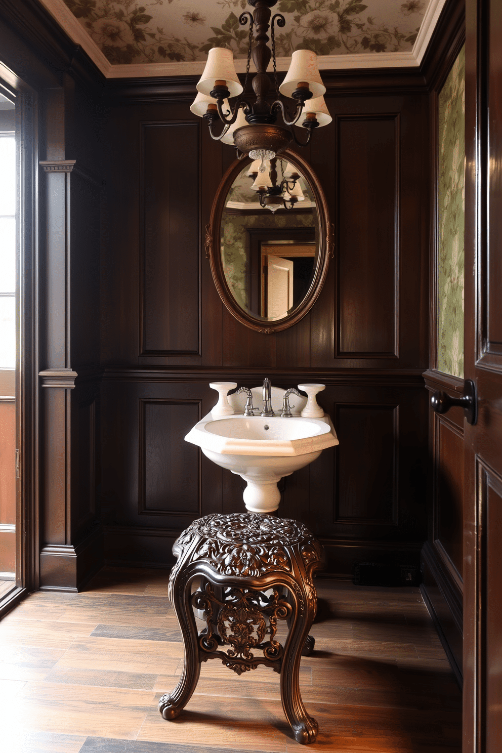 A charming antique stool with intricate carvings sits in a cozy Victorian powder room, complementing the rich, dark wood paneling. The walls are adorned with floral wallpaper, and a vintage chandelier hangs above, casting a warm glow over the elegant porcelain sink.