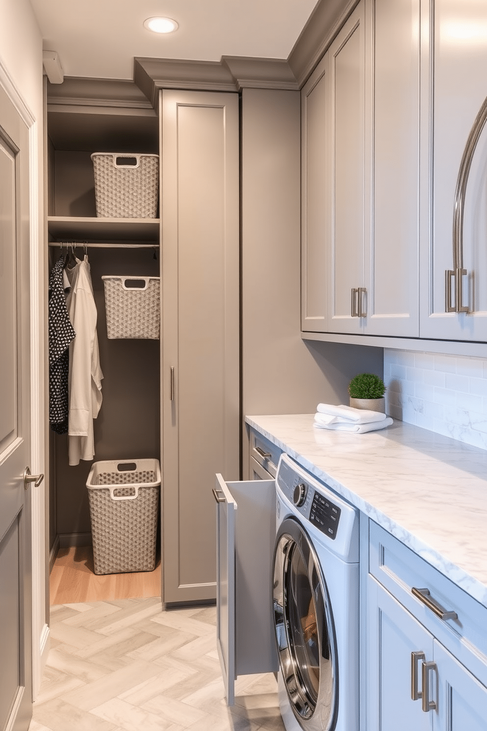 A stylish laundry room featuring a walk-in closet combo with pull-out hampers for easy access. The space is designed with sleek cabinetry in a soft gray finish, complemented by a marble countertop that offers ample folding space.