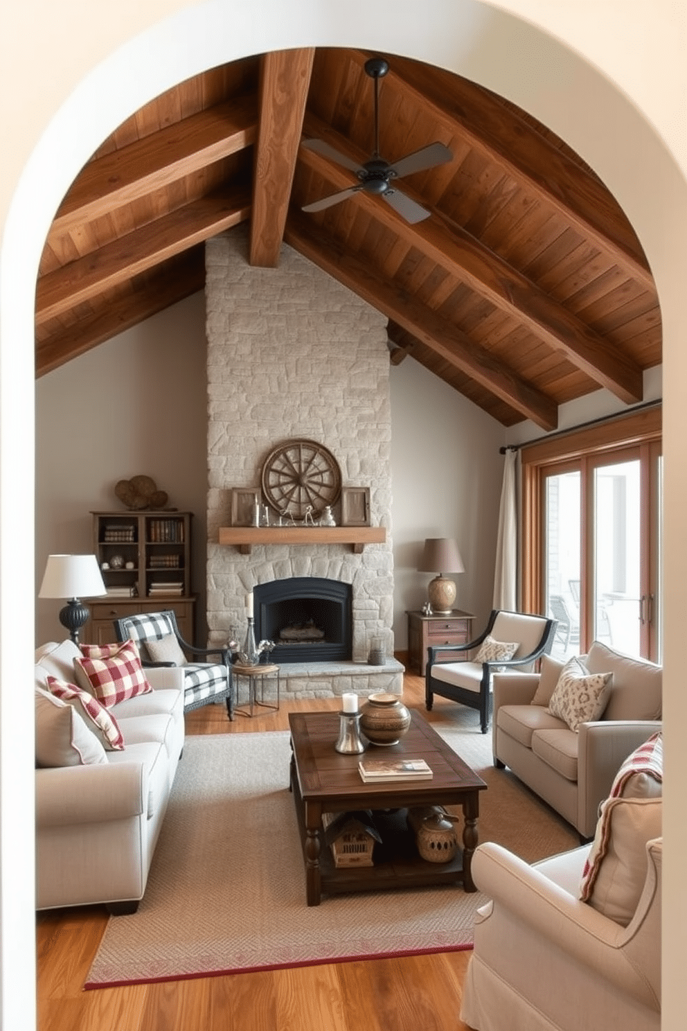 A cozy farmhouse style living area features exposed wooden beams on the ceiling and a large stone fireplace as the focal point. Soft, neutral-toned furniture with plaid accents invites relaxation, while vintage decor pieces add character to the warm, inviting atmosphere. The walkout basement is designed to maximize natural light, featuring large sliding glass doors that open to a private patio. Comfortable seating arrangements with plush cushions and a rustic coffee table create an ideal space for entertaining or family gatherings.