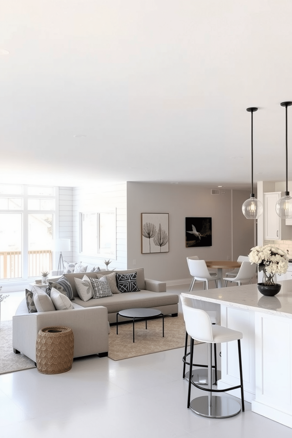 Open concept layout for a spacious feel. The living area seamlessly flows into the dining space, with large windows allowing natural light to flood the room. White basement design ideas. The space features white shiplap walls, a cozy sectional sofa, and a sleek bar area with white cabinetry, creating a bright and inviting atmosphere.