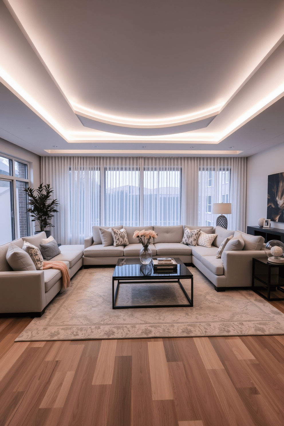 A spacious family room featuring layered lighting with sleek white fixtures that create a warm and inviting atmosphere. The room is adorned with a light gray sectional sofa, complemented by a mix of textured pillows in soft pastels. A large area rug anchors the seating arrangement, while a modern coffee table sits at the center, showcasing a stylish centerpiece. Floor-to-ceiling windows allow natural light to flood the space, with sheer white curtains adding an elegant touch.