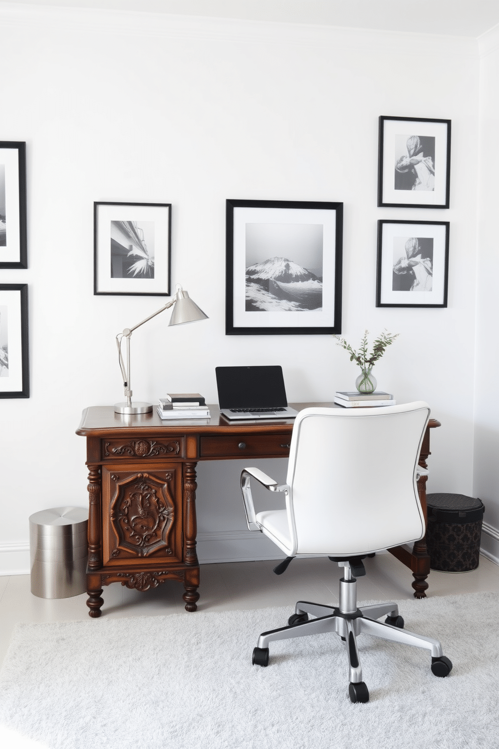 A vintage wooden desk with intricate carvings sits in the center of a bright white home office. Modern accessories, including a sleek metal lamp and a minimalist laptop stand, complement the desk's classic design, creating a harmonious blend of old and new. The walls are painted a crisp white, adorned with framed black-and-white photographs that add a touch of sophistication. A plush area rug in soft gray tones anchors the space, while a stylish ergonomic chair provides comfort for long hours of work.