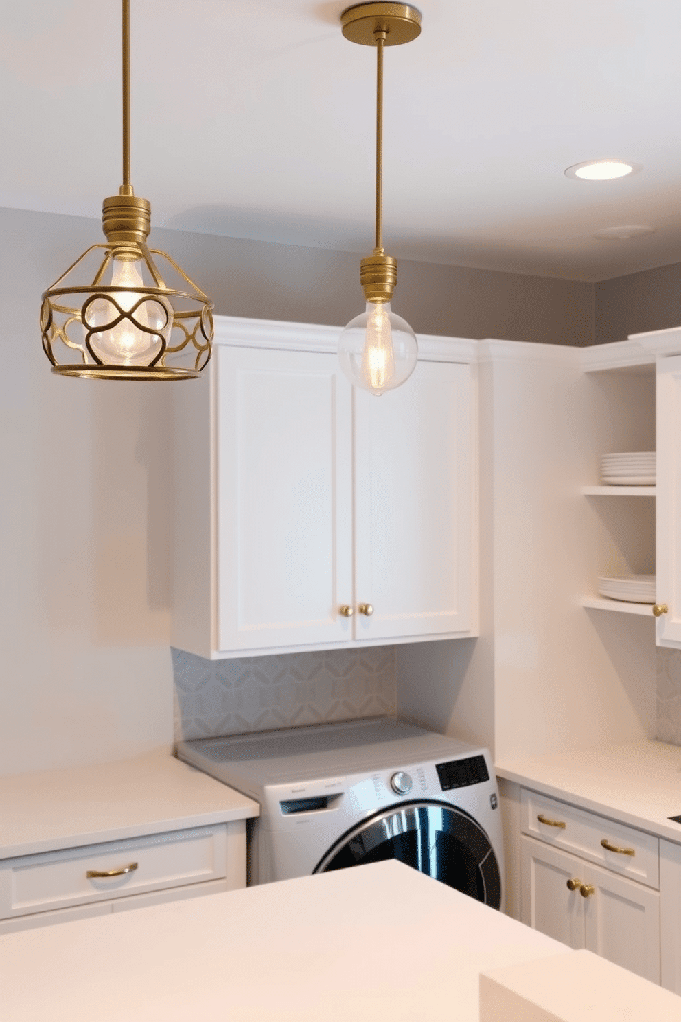 Chic pendant lighting hangs gracefully from the ceiling, casting a warm glow over the space. The fixtures feature intricate designs in brushed gold, complementing the soft white cabinetry and countertops below. The laundry room is designed with a clean, modern aesthetic, featuring sleek white cabinets and a spacious countertop for folding clothes. A stylish backsplash in a subtle geometric pattern adds visual interest, while ample storage solutions keep the area organized and clutter-free.