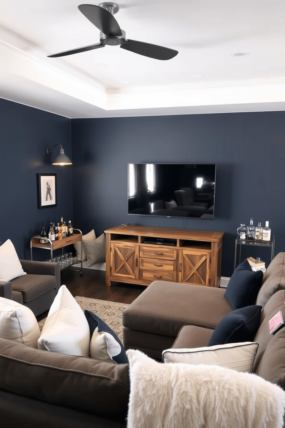 A cozy man cave featuring a plush sectional sofa adorned with white accent pillows for added comfort. The walls are painted a deep navy blue, and a large flat-screen TV is mounted above a rustic wooden media console. In one corner, a stylish bar cart holds an assortment of spirits and glassware, inviting relaxation and entertainment. Soft ambient lighting from industrial-style pendant fixtures enhances the inviting atmosphere, making it the perfect retreat for unwinding or hosting friends.