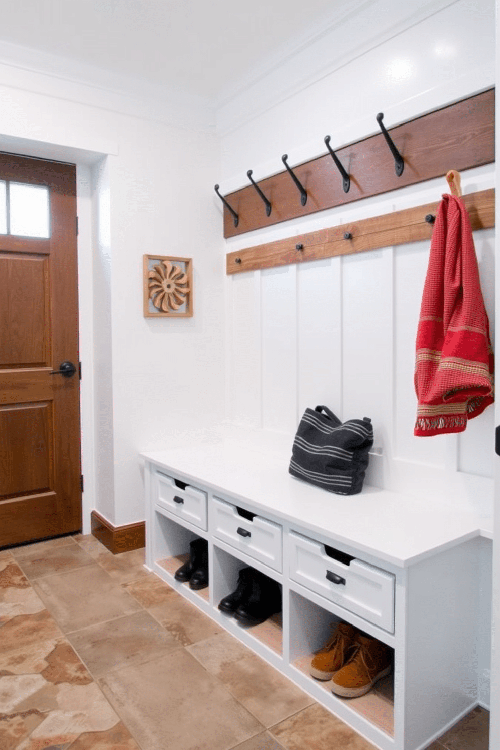 A stylish mudroom features a built-in bench with functional shoe storage underneath, designed to keep the space organized and clutter-free. The walls are painted in a soft white hue, complemented by rustic wooden accents and a durable tile floor that withstands heavy traffic.