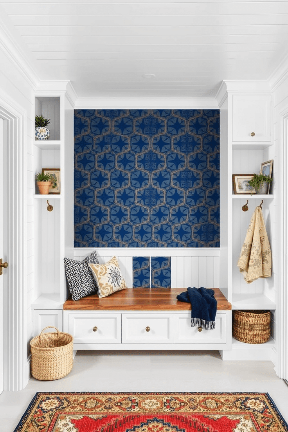 Accent wall with patterned wallpaper. The wall features a bold geometric design in shades of navy and gold, creating a striking focal point in the room. Flanking the accent wall are built-in shelves filled with curated decor and plants, enhancing the overall aesthetic. White mudroom design ideas. The space is brightened by white shiplap walls and a coffered ceiling, complemented by a rustic wooden bench with storage underneath. Hooks for coats and a stylish rug complete the look, making it both functional and inviting.