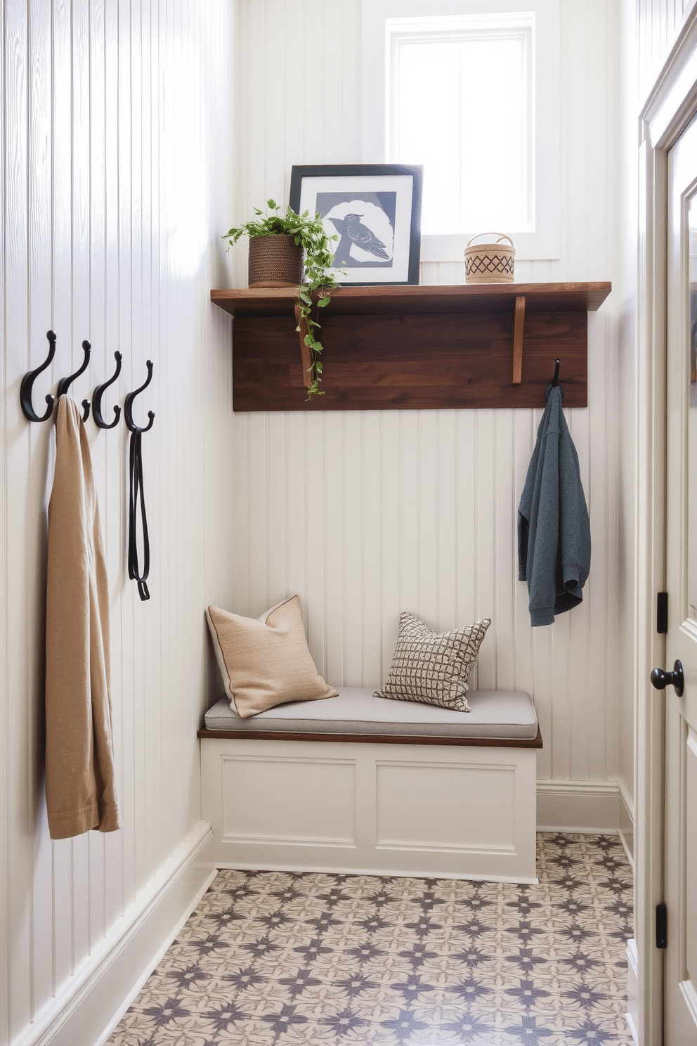 A stylish mudroom featuring classic beadboard paneling that adds texture and charm. The space includes a built-in bench with plush cushions, surrounded by hooks for coats and a rustic wooden shelf above for storage. The floor is adorned with patterned tiles that complement the beadboard, creating a cohesive look. Natural light floods in through a nearby window, illuminating a potted plant that adds a touch of greenery to the design.