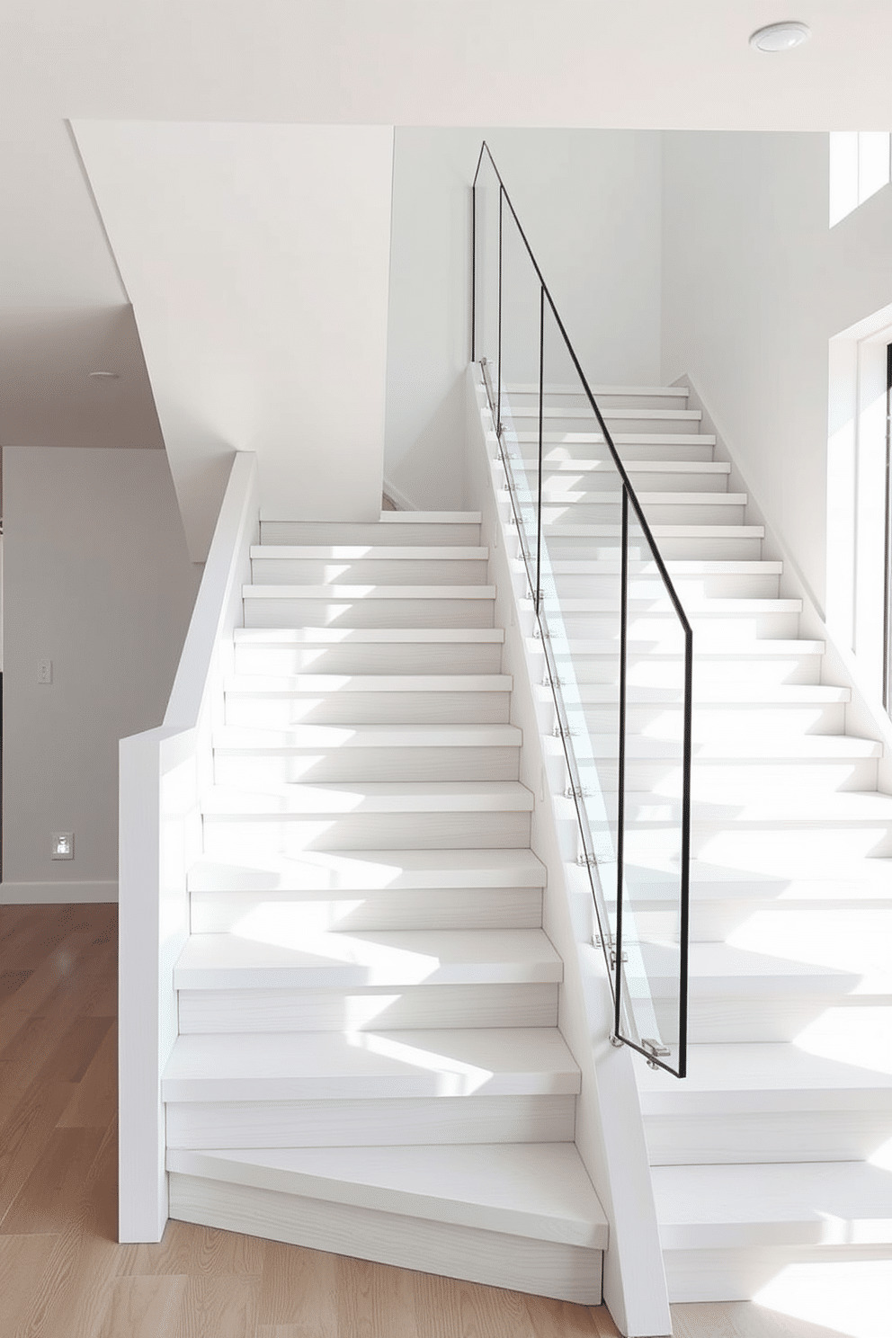 A unique white staircase features an asymmetrical design, showcasing a blend of modern aesthetics and functional elegance. The treads are made of smooth white wood, while the risers are adorned with a textured finish that adds depth and interest. The handrail, crafted from sleek glass, provides a striking contrast against the solid structure of the staircase. Natural light floods the space, highlighting the architectural lines and creating a warm, inviting atmosphere.