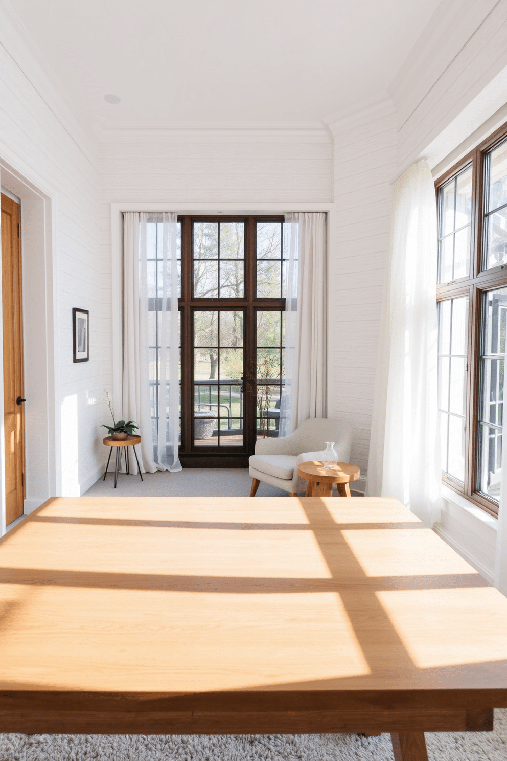 A bright and airy study room featuring a large wooden desk with a smooth, polished surface. The walls are adorned with textured white panels that create visual depth, complemented by a plush, light gray area rug underfoot. A cozy reading nook is nestled in one corner, with a comfortable armchair upholstered in soft linen and a small side table made of reclaimed wood. Large windows allow natural light to flood the space, enhancing the serene atmosphere with sheer white curtains that gently diffuse the sunlight.