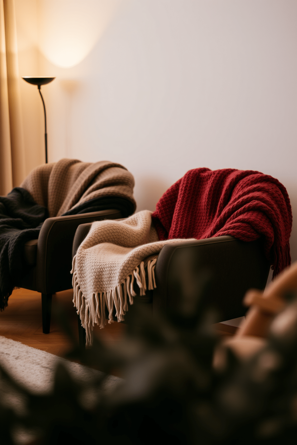 A cozy winter apartment setting featuring warm woolen blankets draped over stylish armchairs. Soft, ambient lighting casts a warm glow, enhancing the inviting atmosphere of the space.