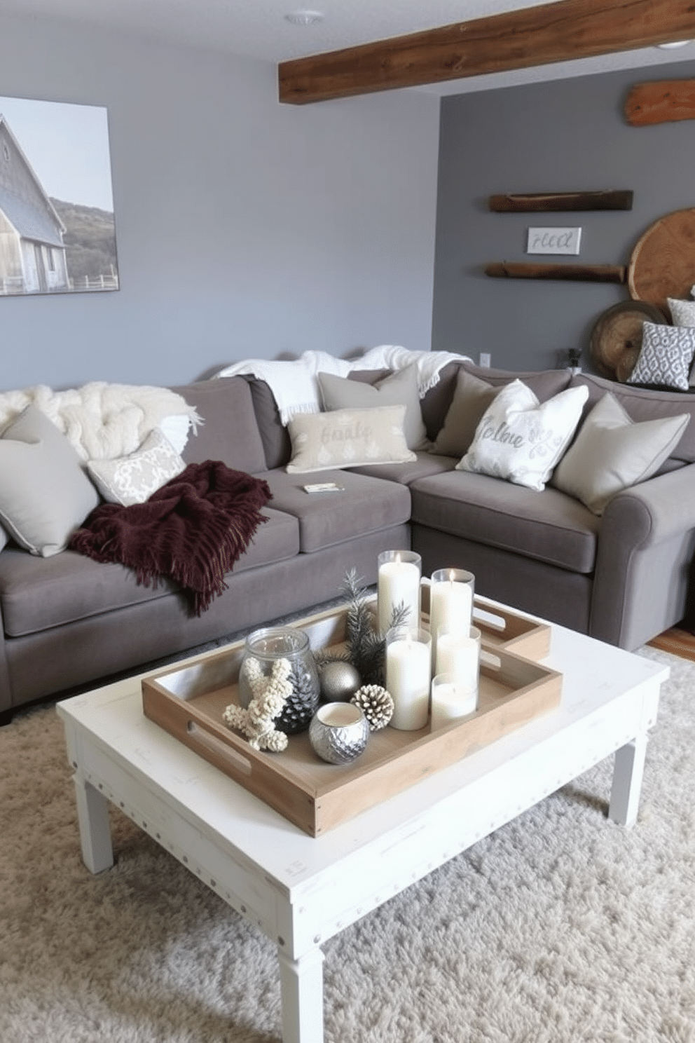 A cozy winter basement retreat featuring decorative trays to organize various items. Soft blankets and pillows are artfully arranged on a plush sectional sofa, creating an inviting seating area. The walls are painted a warm gray, complemented by rustic wooden accents throughout the space. A large area rug adds texture, while a stylish coffee table holds a collection of seasonal decor and candles on the decorative trays.