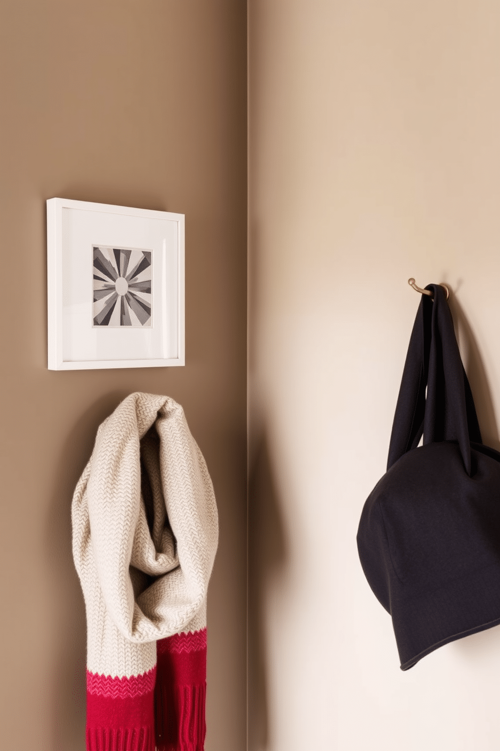 A stylish winter closet featuring hanging hooks for scarves and hats. The walls are painted in a warm taupe color, and the hooks are made of brushed brass for an elegant touch.