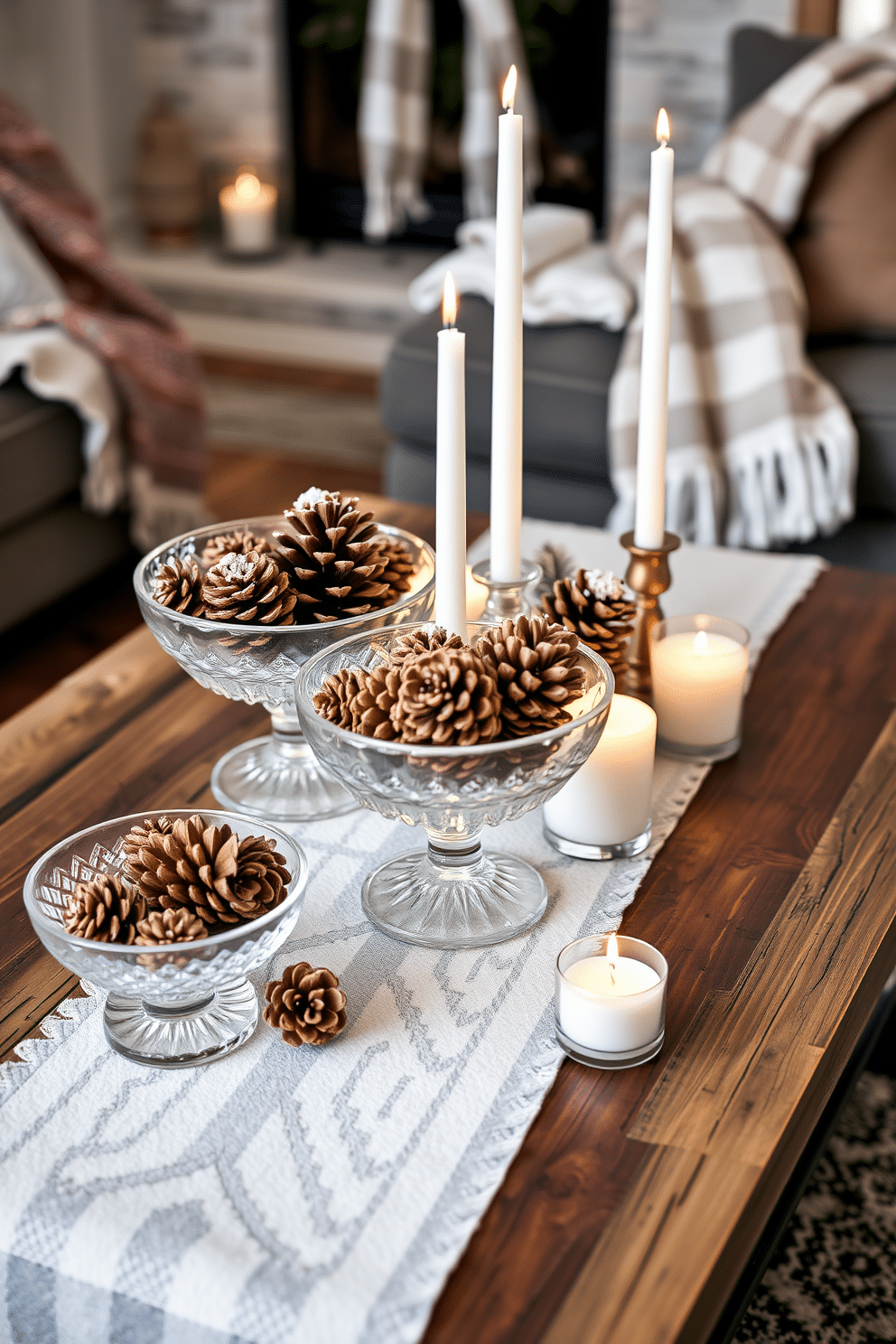 A cozy winter setting featuring decorative pinecones arranged in elegant glass bowls. The bowls are placed on a rustic wooden coffee table, surrounded by soft, warm throws and candles that create a welcoming ambiance.