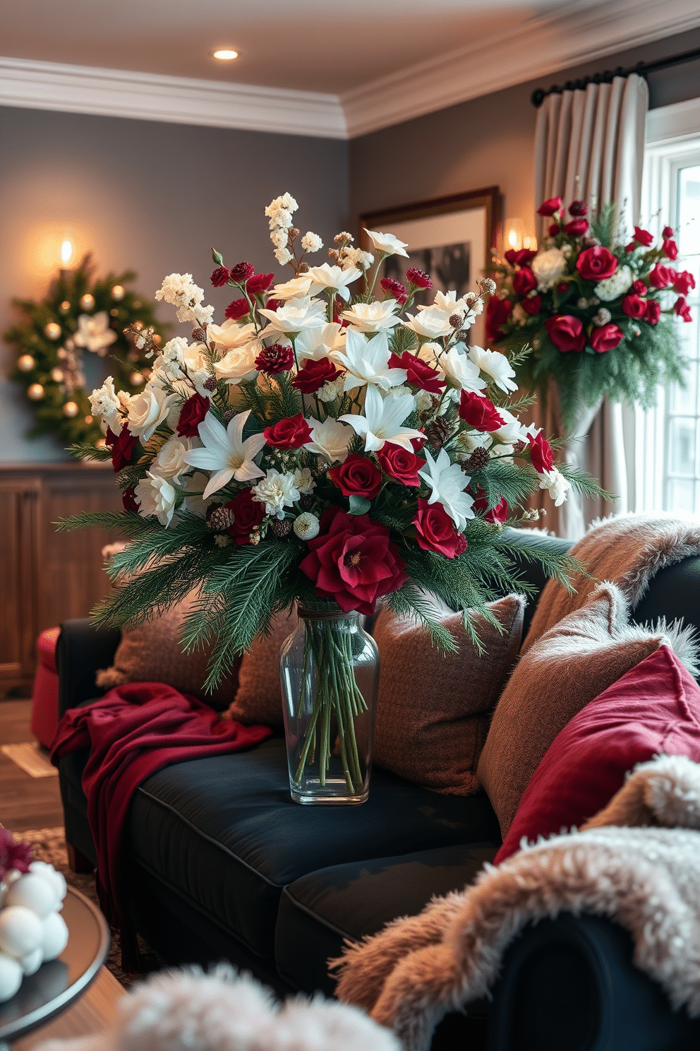 A cozy living room adorned with floral arrangements featuring winter blooms. The centerpiece is a large vase filled with white and deep red flowers, complemented by evergreen branches and pinecones. Soft, warm lighting illuminates the space, creating an inviting atmosphere. Plush throw blankets and cushions in rich jewel tones are scattered across a deep navy sofa, enhancing the winter decor theme.