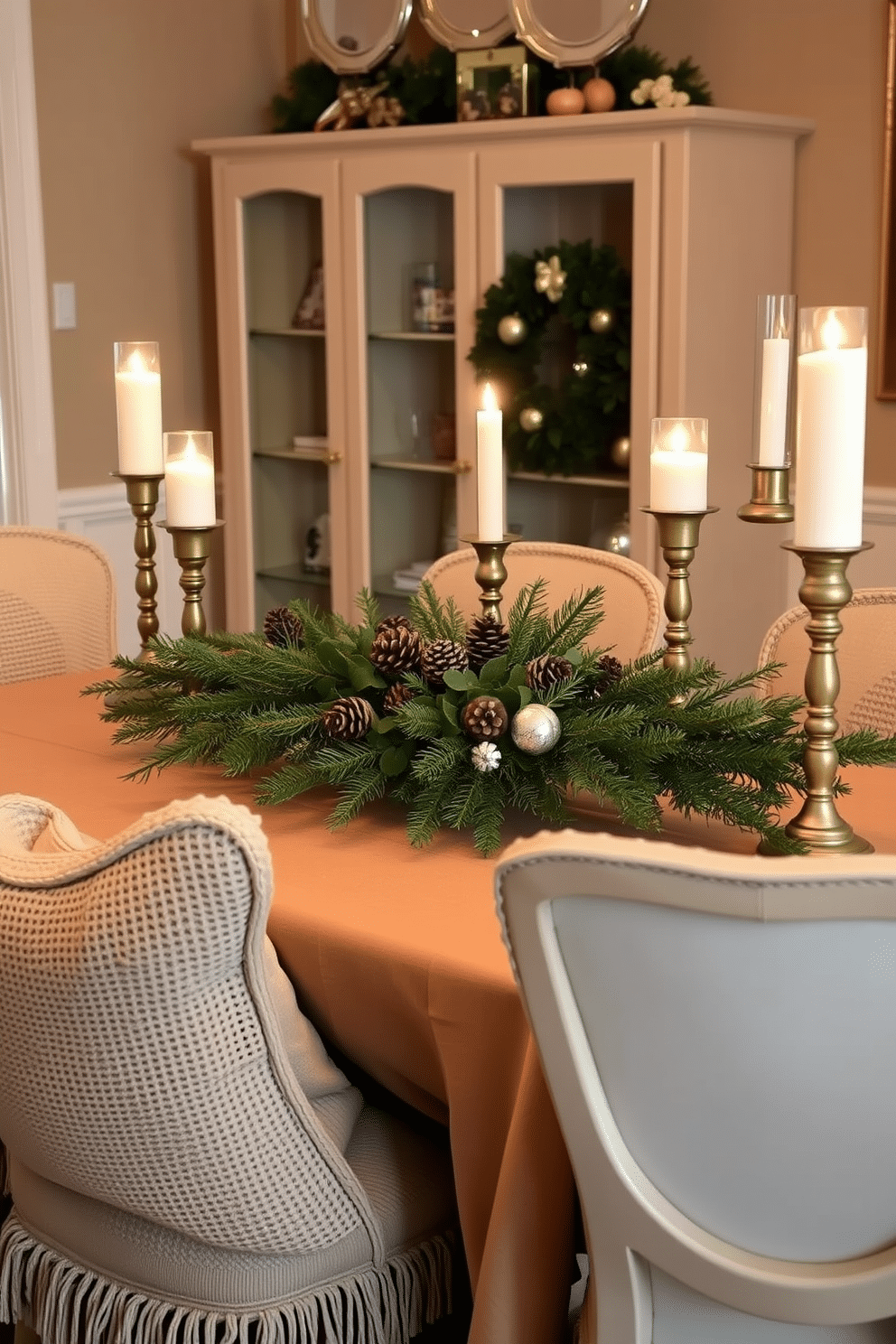 A cozy winter dining room setting. The table is adorned with a warm tablecloth, and textured pillows in soft fabrics are placed on the chairs for added comfort. A centerpiece of evergreen branches and pinecones adds a natural touch. Soft candlelight flickers from elegant holders, creating a warm and inviting atmosphere.