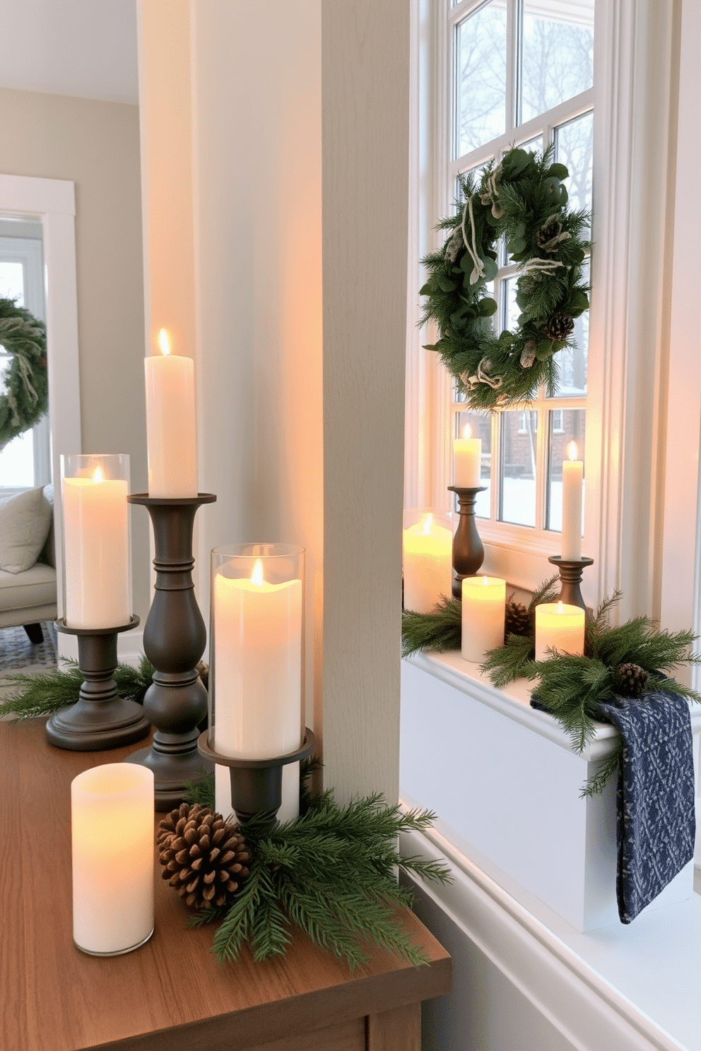 A cozy winter entryway features candles in varying heights placed on surfaces like a console table and window sills. The soft glow of the candles creates a warm and inviting atmosphere, complemented by seasonal decor such as pinecones and evergreen branches.