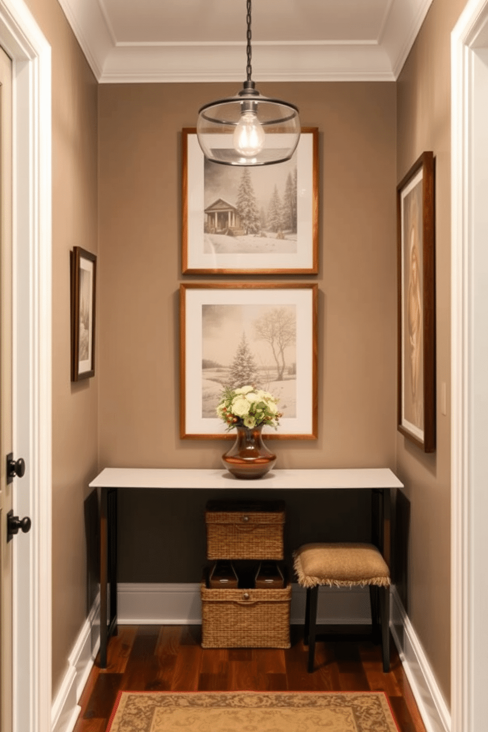 A cozy winter entryway features seasonal art prints elegantly displayed on the walls. The prints showcase festive themes with soft color palettes, enhancing the warm and inviting atmosphere of the space.