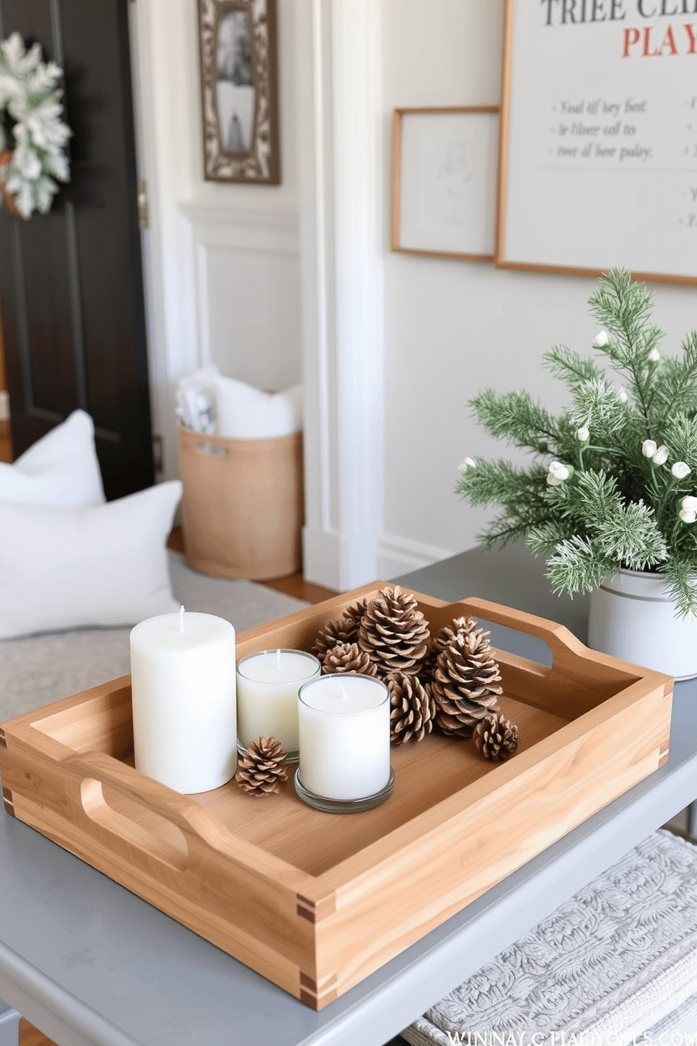 A winter entryway decorated with decorative trays for organizing small items. The trays are made of natural wood and feature intricate carvings, placed on a console table by the door. Soft white and pale blue accents are used throughout the space to evoke a cozy winter atmosphere. A cluster of pinecones and candles sit in the trays, enhancing the seasonal charm while keeping the area tidy.