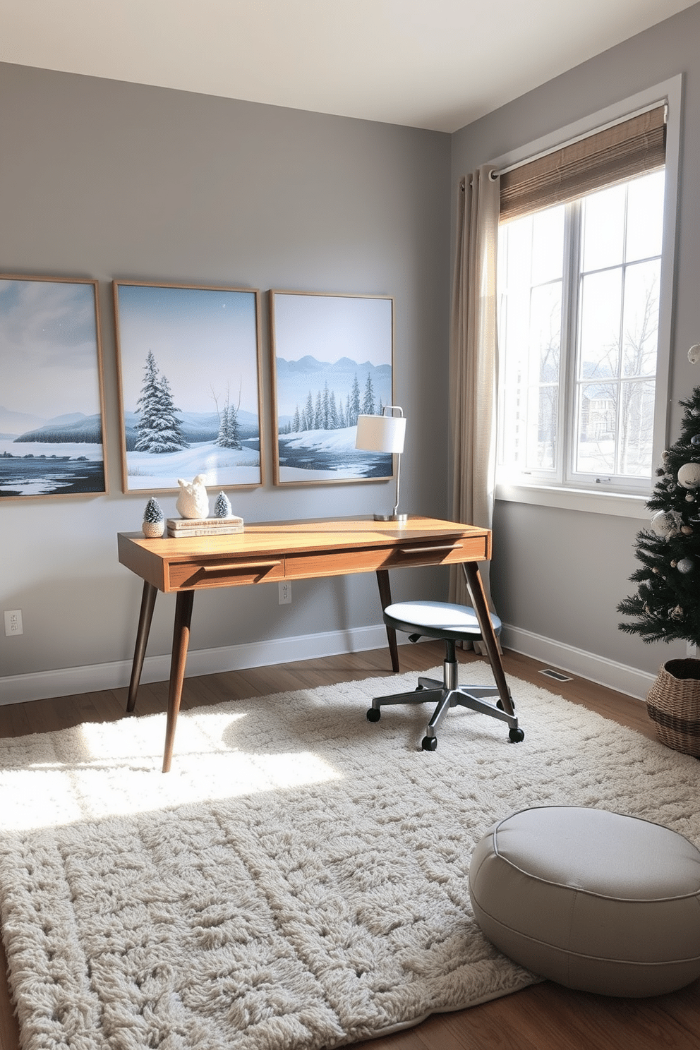 A cozy winter-themed home office space adorned with seasonal artwork depicting serene winter landscapes. The walls are painted in a soft gray tone, and a plush area rug in neutral colors enhances the warmth of the room. A sleek wooden desk is positioned by a large window, allowing natural light to flood the space. On the desk, a stylish lamp and a few decorative winter-themed items create an inviting atmosphere for productivity.