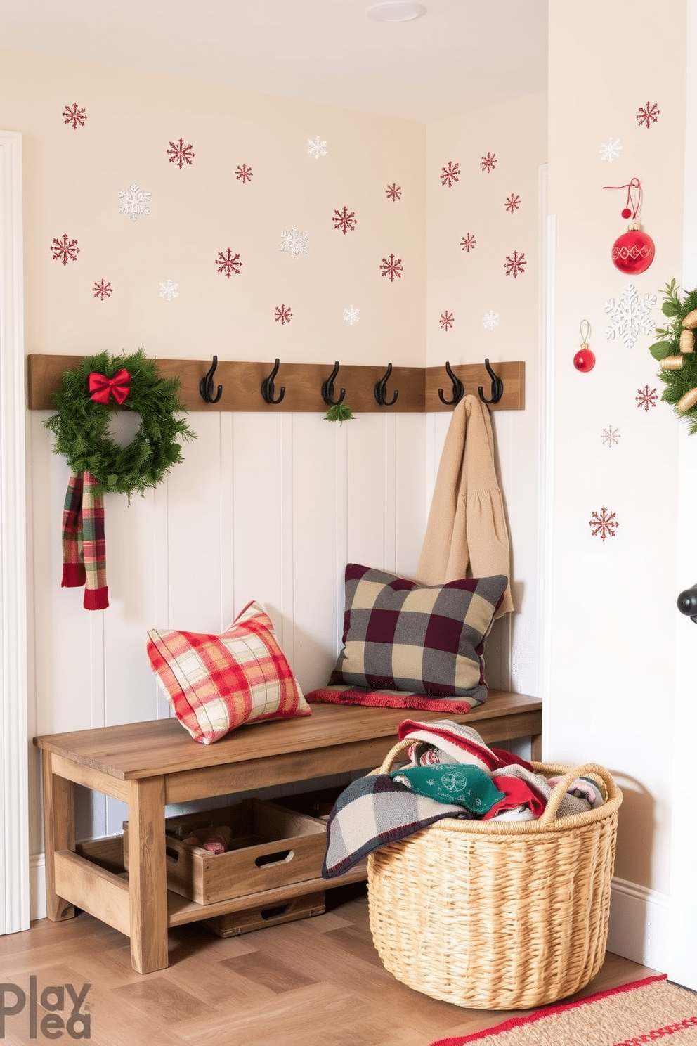 Holiday themed wall decals adorn the walls of a cozy mudroom filled with seasonal cheer. The decals feature snowflakes and festive ornaments, creating a warm and inviting atmosphere. The mudroom is decorated with a rustic bench and hooks for coats, all set against a backdrop of soft, neutral colors. A woven basket filled with colorful blankets sits beside the bench, adding a touch of comfort and style.