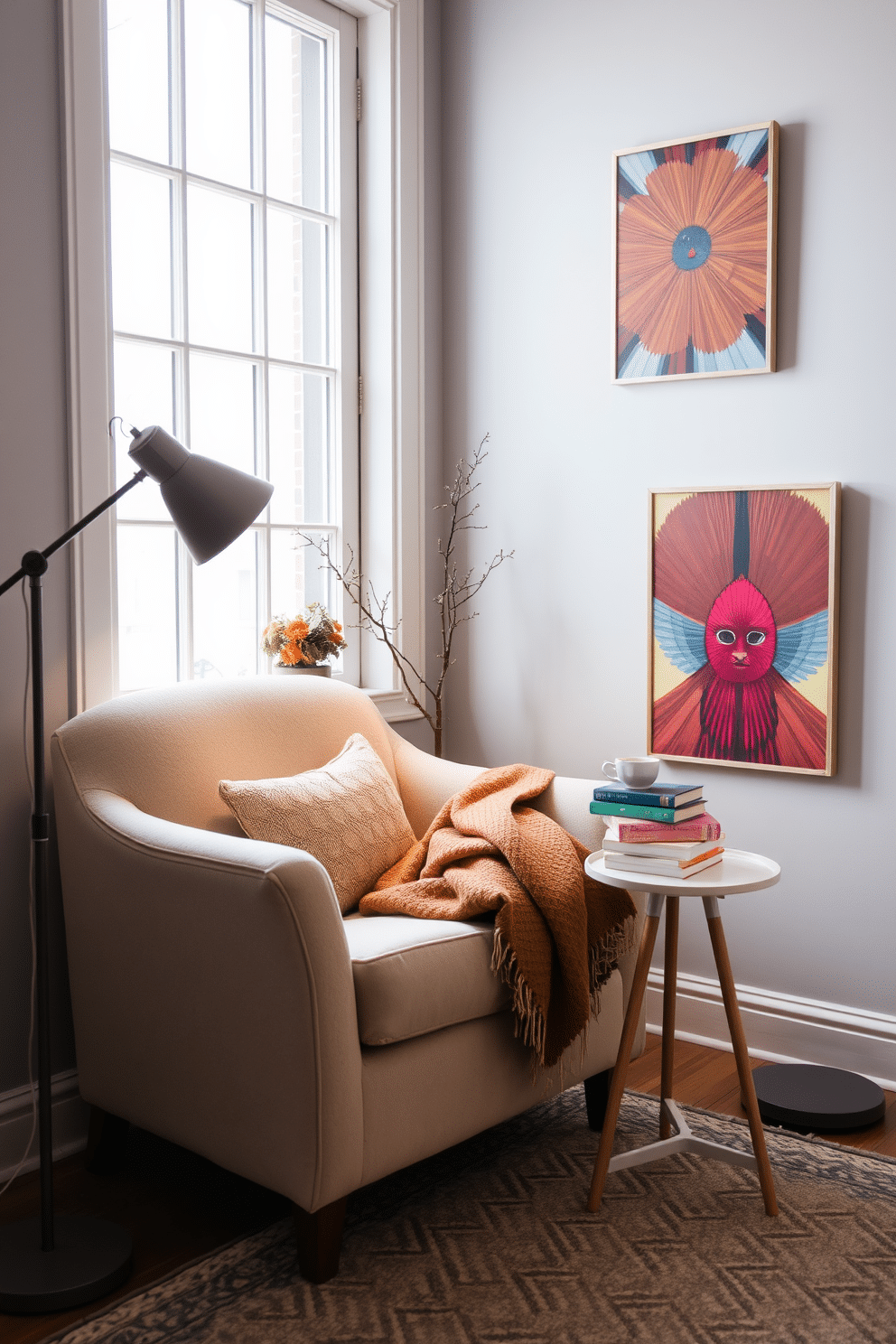 A cozy winter reading nook featuring a plush armchair in a soft beige fabric positioned near a large window. A small side table holds a steaming mug of tea and a stack of colorful books, while a warm throw blanket drapes over the armchair. The walls are painted in a light gray hue, creating a serene backdrop for vibrant artwork. A stylish floor lamp illuminates the space, and a patterned area rug adds texture underfoot, enhancing the inviting atmosphere.