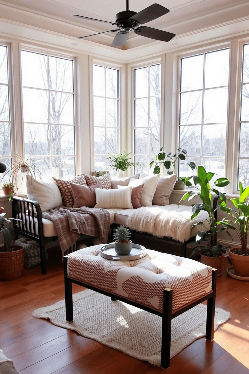 A cozy winter sunroom featuring a stylish daybed adorned with plush cushions in soft, neutral tones. Large windows allow natural light to flood the space, highlighting the warm wooden floors and a collection of potted plants in the corners.