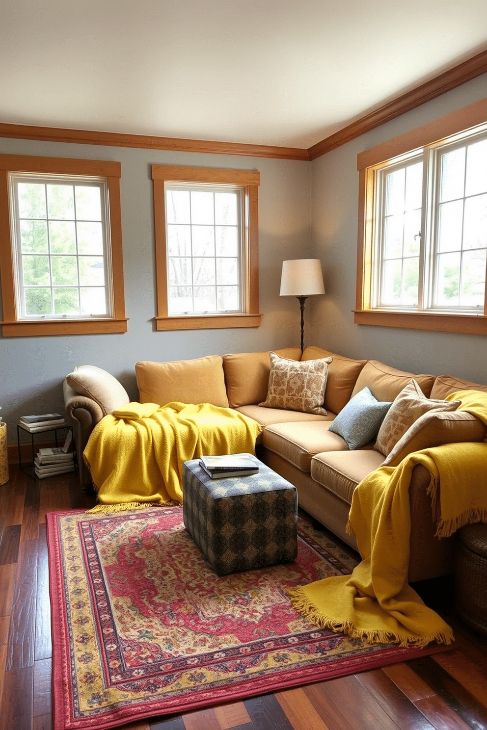 A cozy yellow basement retreat featuring soft yellow blankets draped over a plush sectional sofa, inviting warmth and relaxation. The walls are painted a light gray, complemented by warm wood accents, while large windows allow natural light to flood the space. In one corner, a small reading nook is created with a stylish armchair and a stack of books, enhancing the inviting atmosphere. The flooring is a rich, dark wood, and a colorful area rug adds texture and vibrancy to the overall design.